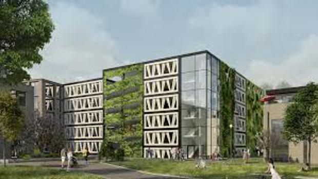 Од отпад до архитектура: Фасадата на гаража во Шведска од лопатки на ветерни турбини