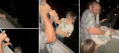 Застрашувачка снимка: Пијан татко го држи својот син на јаже, 24 метри над земја, од прозорец на зграда – за забава