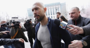 Покренато обвинение против Ендрју Тејт за трговија со малолетници и перење пари